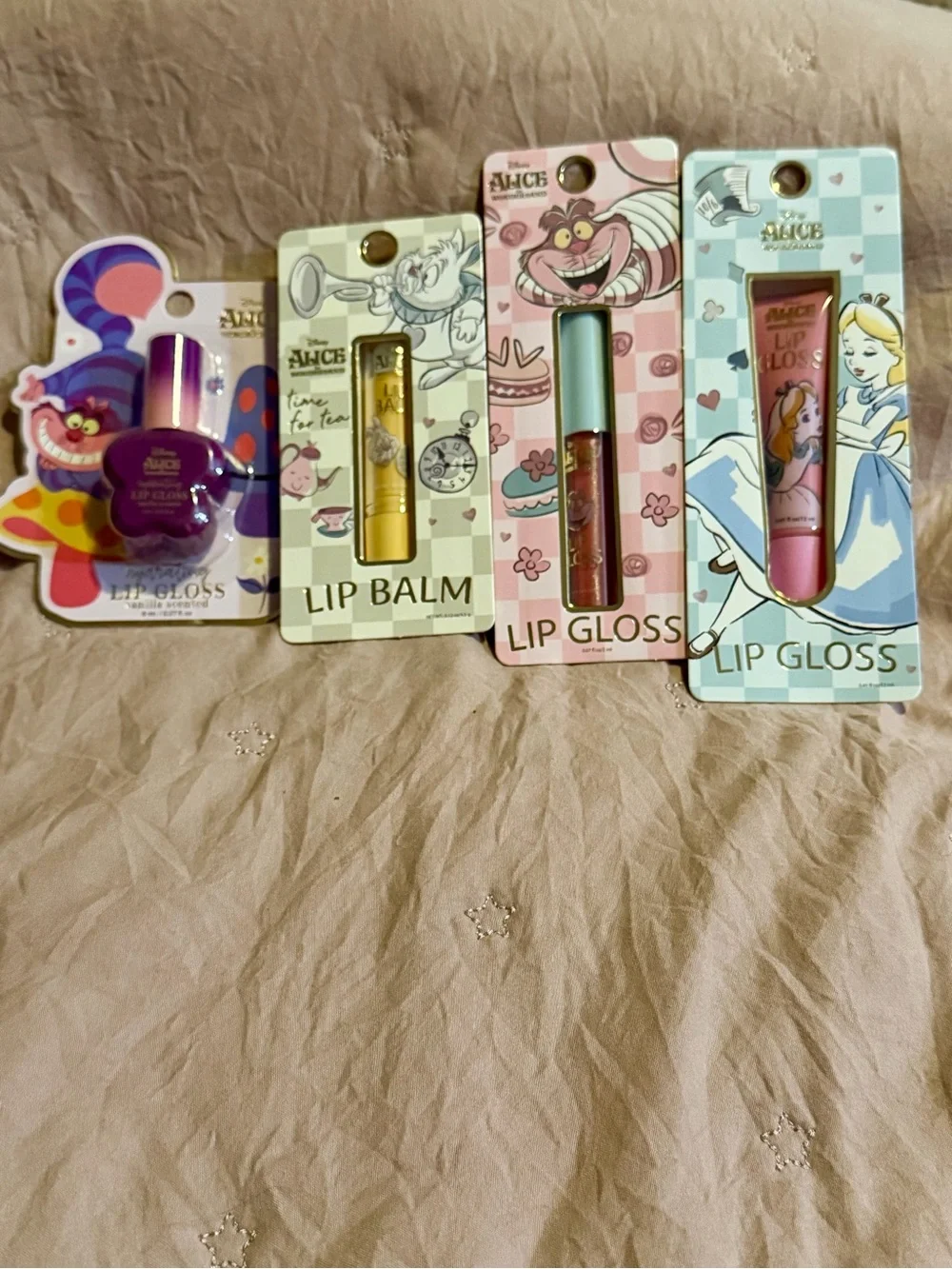 4 piece Alice in Wonderland Lip Gloss & Balm Set - Purple, Gold, Pink, Blue